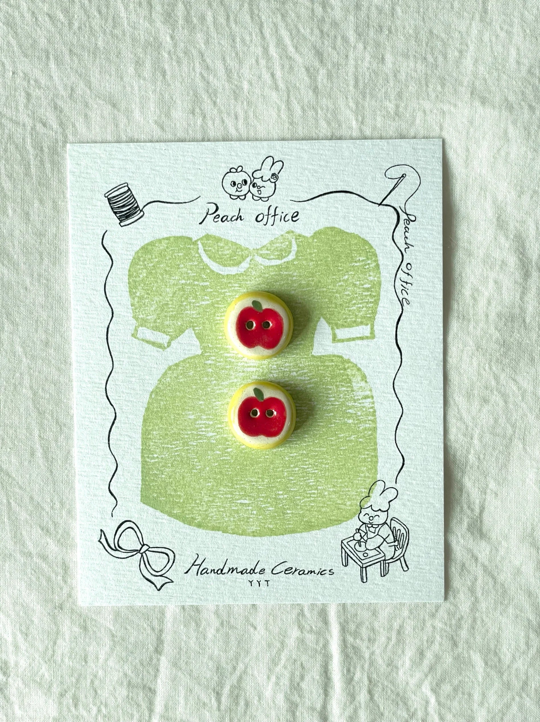 red apple buttons