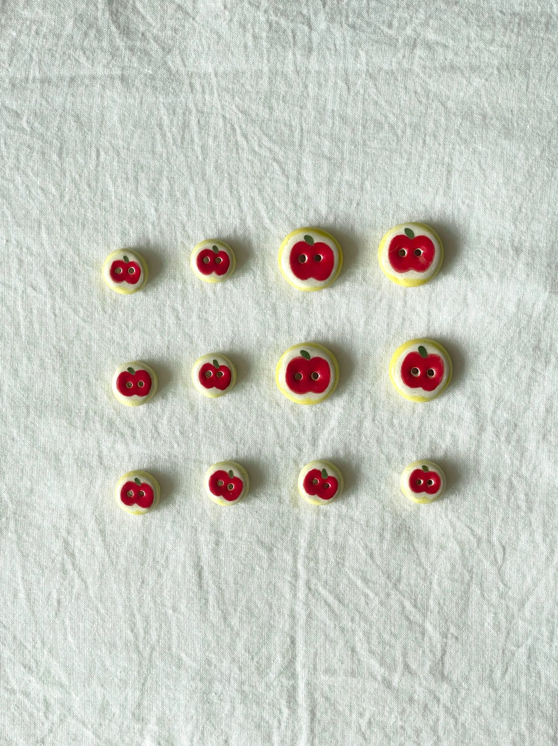 red apple buttons