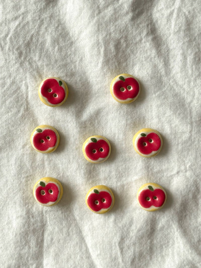red apple buttons